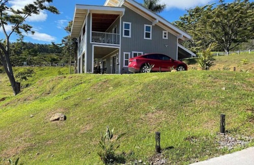 Honokaa Cottage | Custom cottage feels bright & airy yet cozy and private in this country setting.