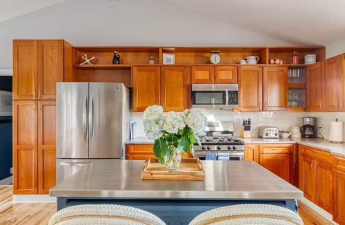 Miami Park House | Escape to our 3BR South Haven home in an exclusive community, just a 5-min walk to a private Lake Michigan beach. Comfortably sleeps 8. Features a private hot tub, chef's kitchen, and cozy fireplace. Perfect for families