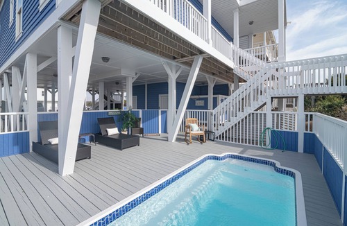 Holden Beach House | Experience oceanfront luxury at Sur La Mer, a 5-bedroom dog-friendly retreat with a private pool.
