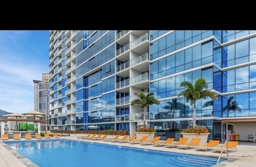 Downtown Honolulu Apartment | Luxury Condo with full view of the Ocean, Lanai, Pool, Hot Tub, Gym & Playground
