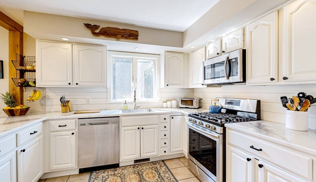Charming tree-lined home with outdoor games, firepit, grill, W/D, & AC