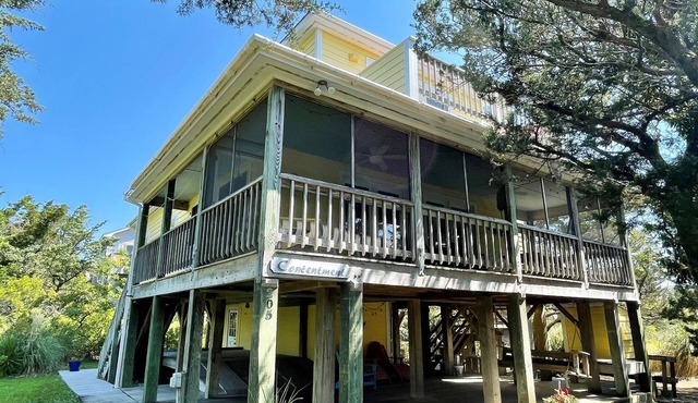Contentment: Spacious home, den, screened porch, marsh views.