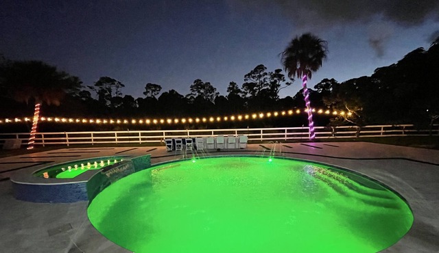 Modern home with heated swimming pool and 5 acre private lot