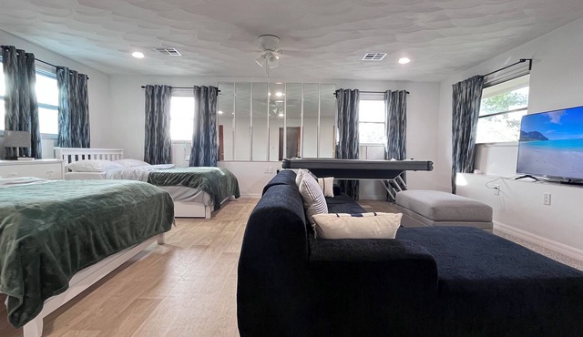 Spacious 5-bedroom pool house in Cape Canaveral with air hockey WiFi, AC