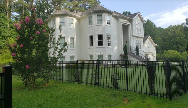 Spaciously inviting 8-bedroom w/en suites, 2 kitchens, fitness room, theater
