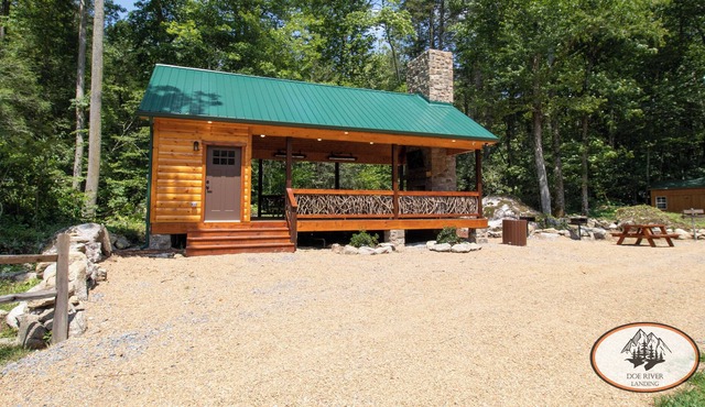 This riverfront event pavilion touts scenic Roan Mt. views & LOADS of amenitie for your gathering!
